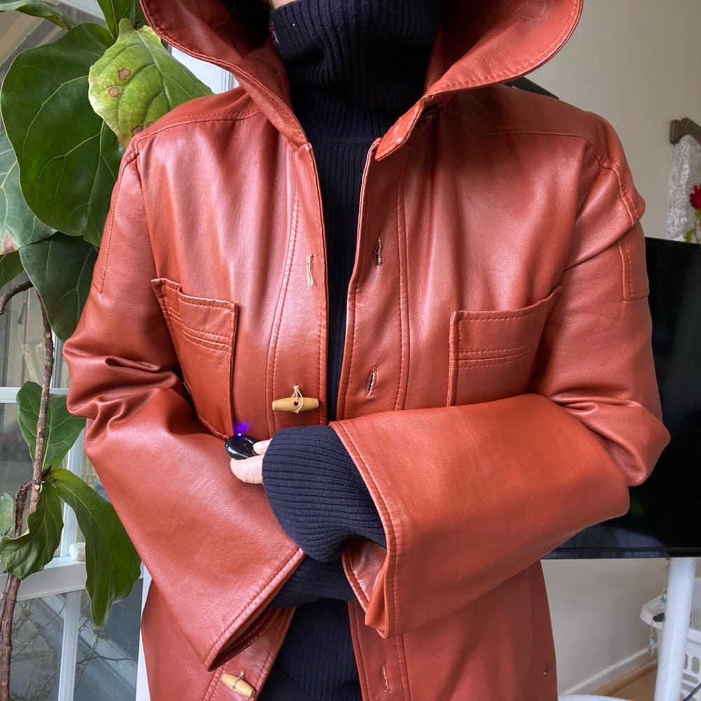 Vintage 1970s Sirocco burnt orange faux leather button down jacket with hood